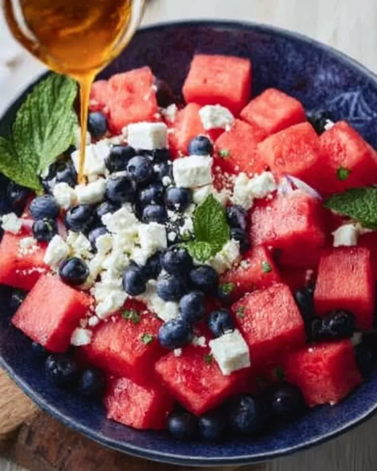Watermelon blueberry feta salad served with fresh ingredients in a bowl.