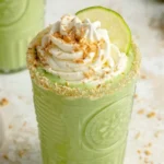 Creamy Coconut Key Lime Pie Smoothie in a glass with lime garnish
