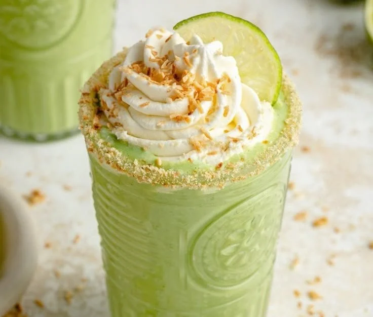 Creamy Coconut Key Lime Pie Smoothie in a glass with lime garnish