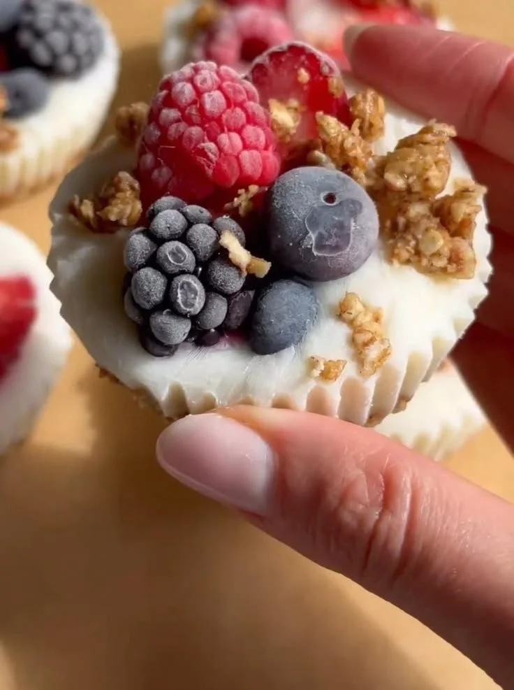 Frozen Yogurt Granola Cups topped with fresh fruits and granola.