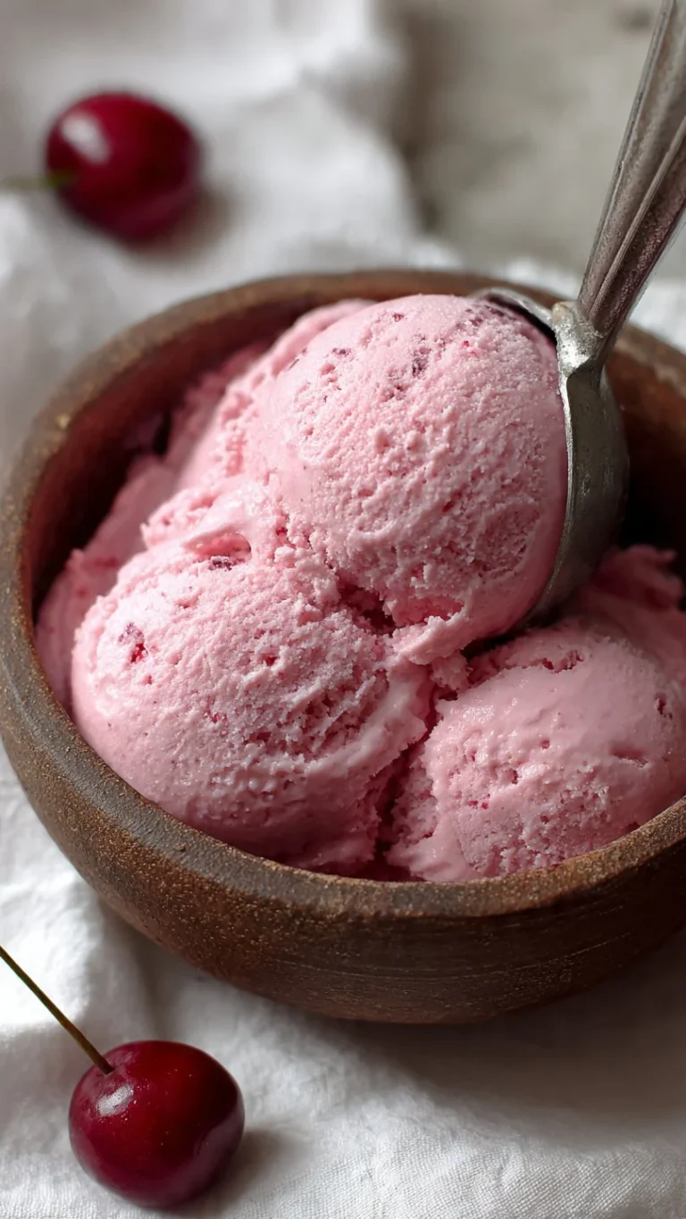 Cherry Amaretto Ice Cream served in a bowl with cherries on top