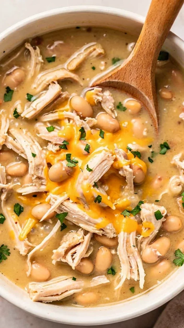 Bowl of white chicken chili topped with cilantro and jalapeños